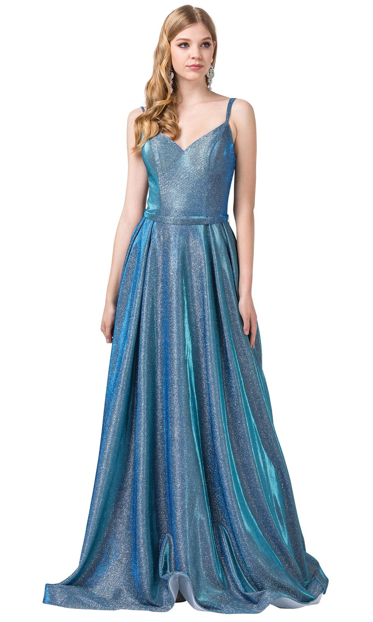 A woman wearing a blue Metallic Long A-Line Prom Dress with side pockets, featuring thin straps, a fitted bodice, and a flared floor-length skirt, stands against a white background.